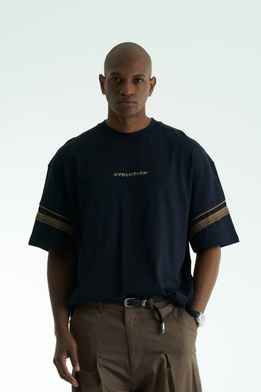 Navy Evolution oversized crewneck graphic T-shirt with sleeve trim and ornate back print in black, white, navy, and cream