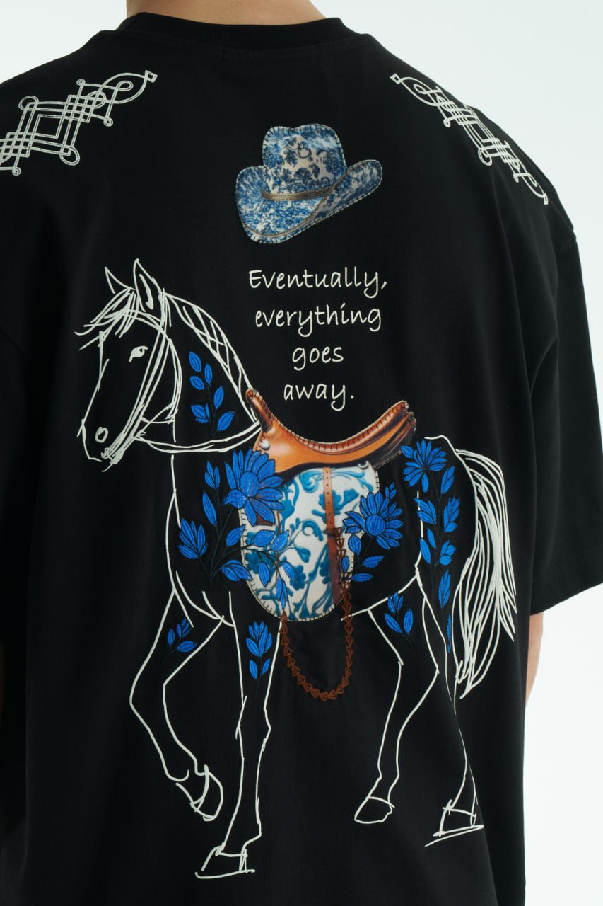 Black Oversized graphic T-shirt with chest print and large back horse-and-hat artwork reading “Eventually, everything goes away.”