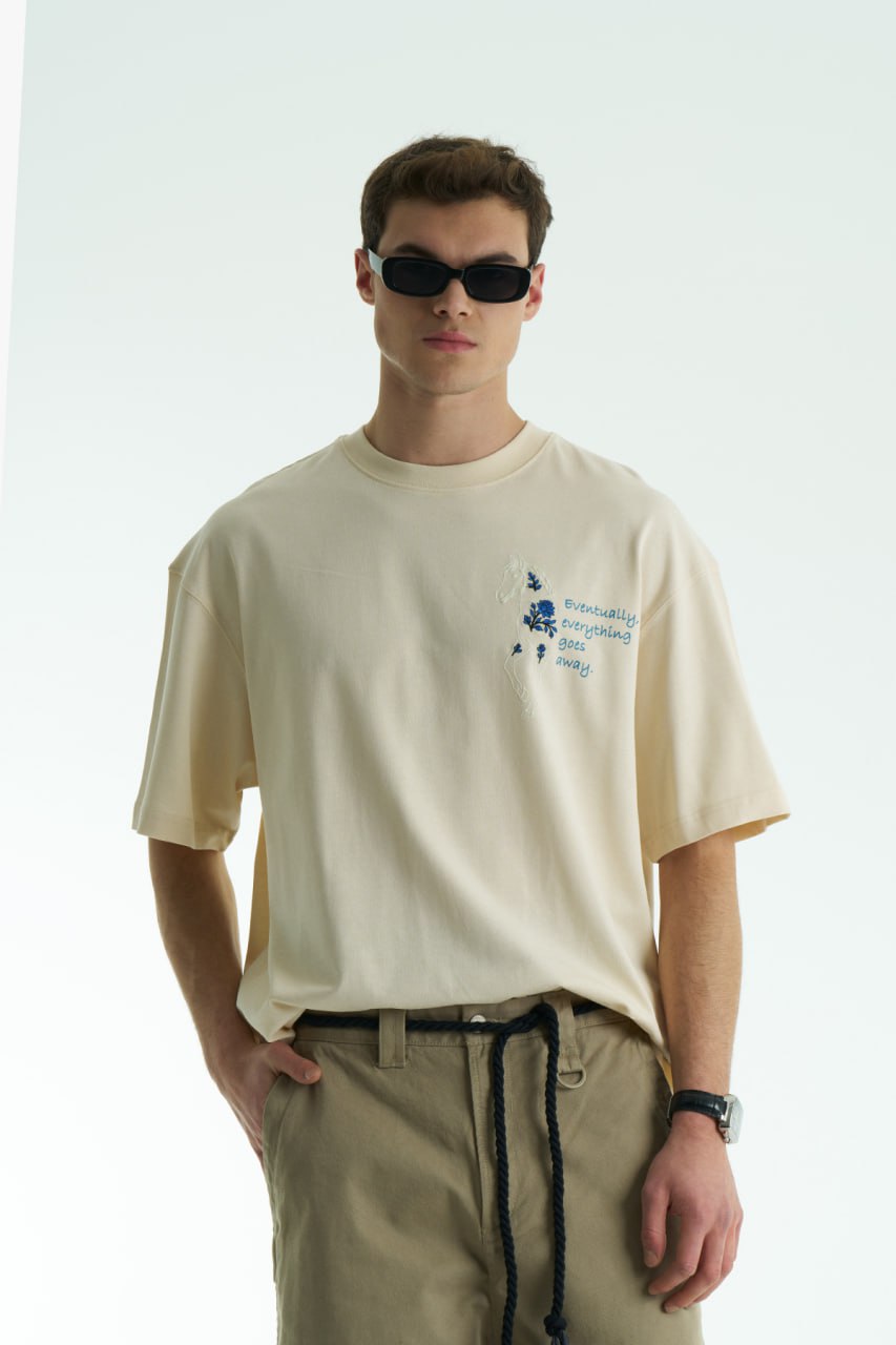 Cream Oversized graphic T-shirt with chest print and large back horse-and-hat artwork reading “Eventually, everything goes away.”