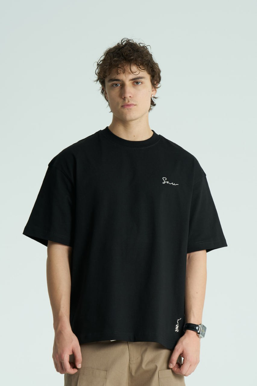 Black Sewn oversized crewneck graphic T-shirt with script chest logo and crochet-framed illustrated back print in black and white