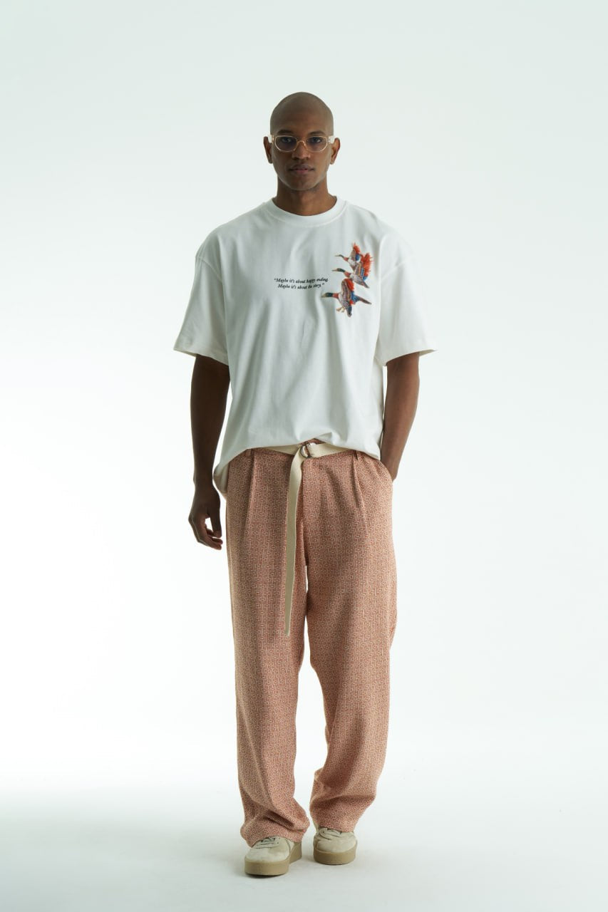 White Oversized cotton T-shirt with embroidered flying ducks and quote print, shown in multiple colorways front and back.