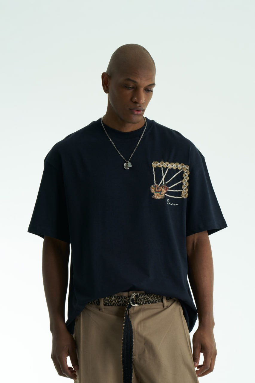 Navy Senu oversized crewneck graphic T-shirt with rope-frame tapestry emblem, shown in black, white, brown and navy with front and back views