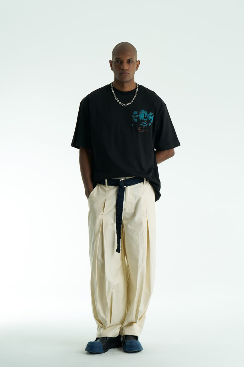 Black Vincent oversized cotton graphic T-shirt with shattered portrait back print, shown in navy, black, and white on model