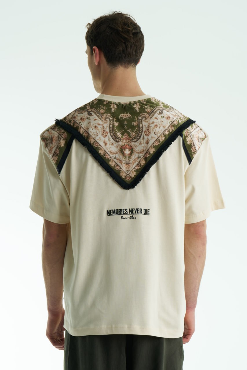 Beige Oversized Memories Never Die cotton tee with chest pocket appliqué and scarf-style back yoke, shown in white, beige, and black.