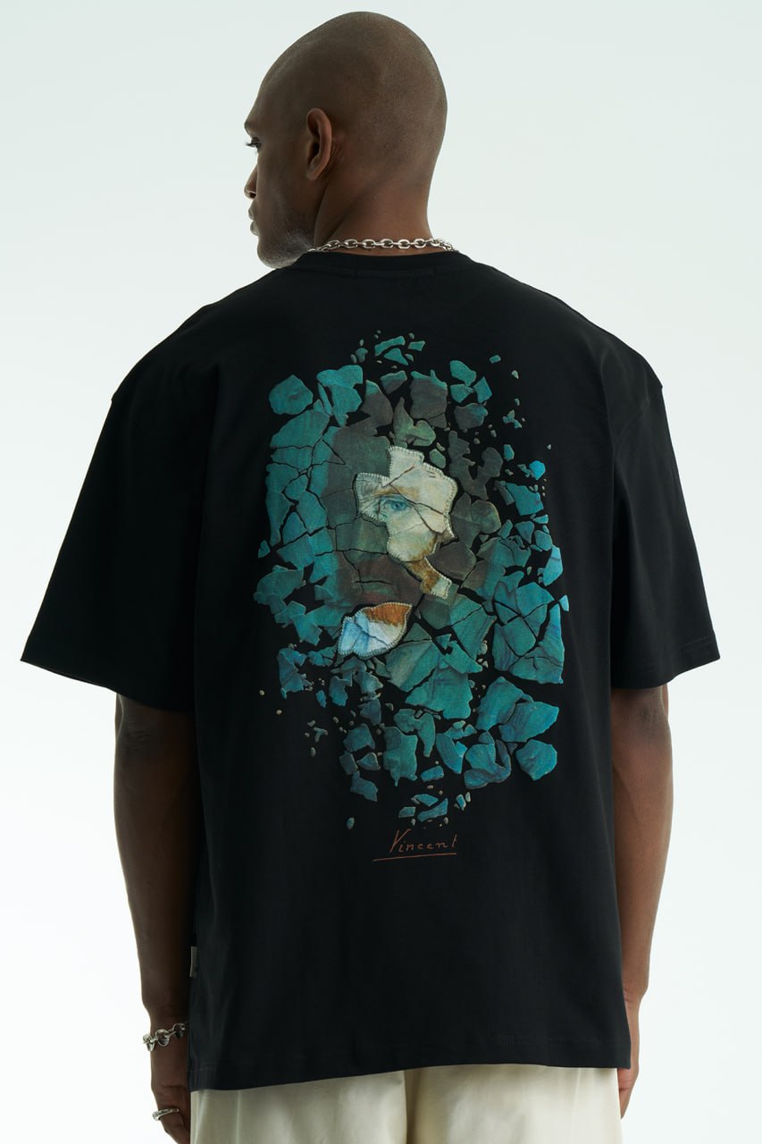 Black Vincent oversized cotton graphic T-shirt with shattered portrait back print, shown in navy, black, and white on model