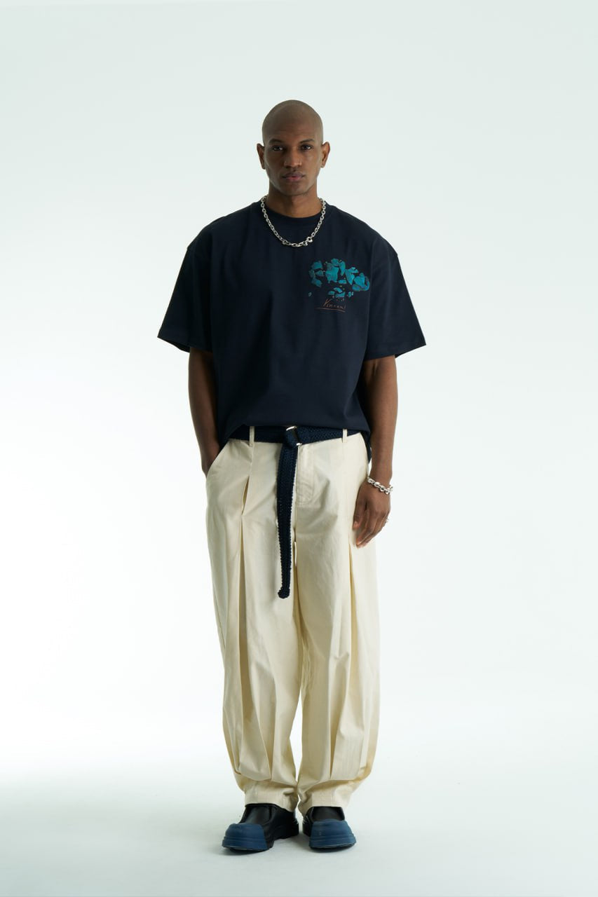 Navy Vincent oversized cotton graphic T-shirt with shattered portrait back print, shown in navy, black, and white on model
