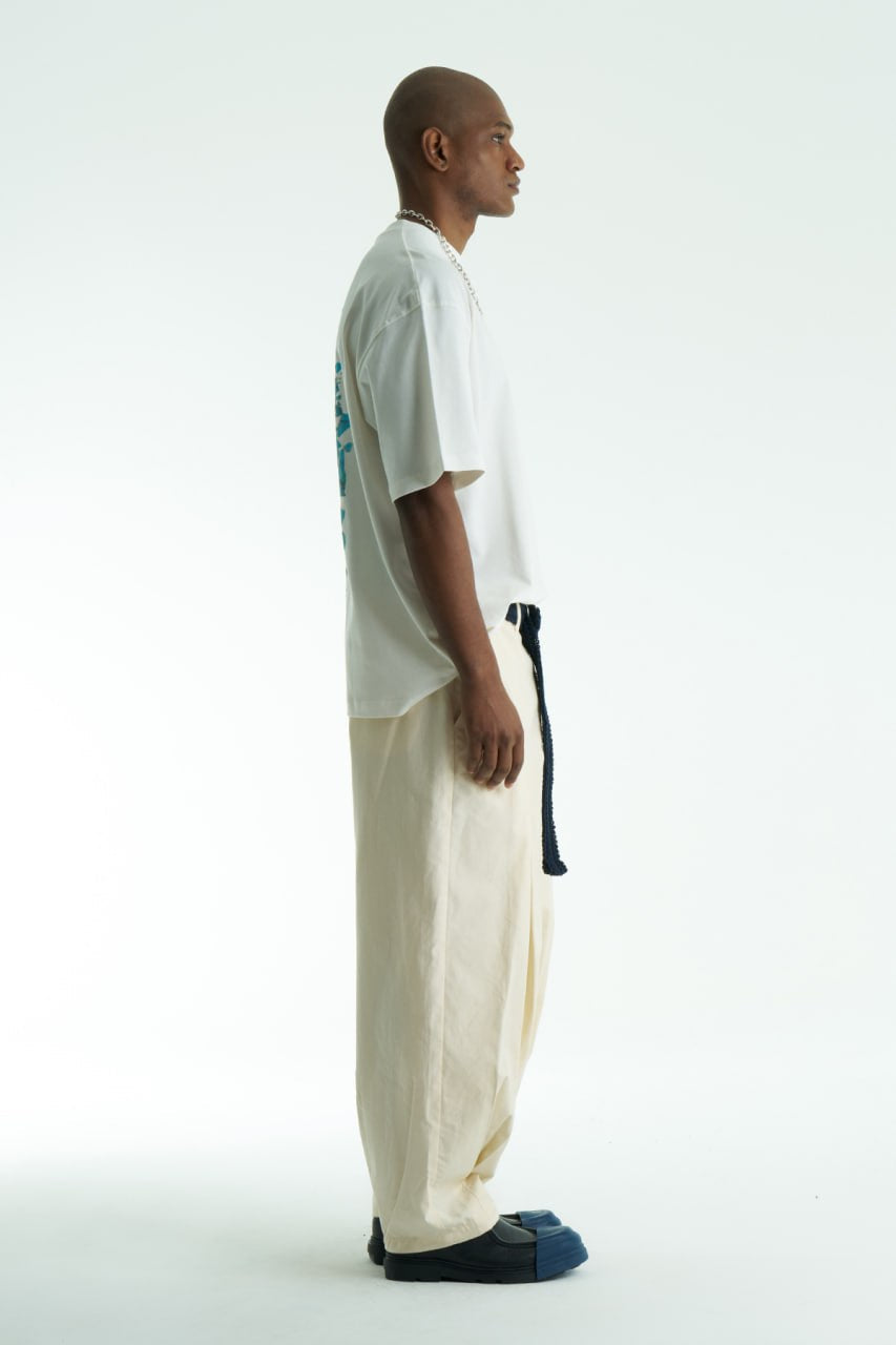White Vincent oversized cotton graphic T-shirt with shattered portrait back print, shown in navy, black, and white on model