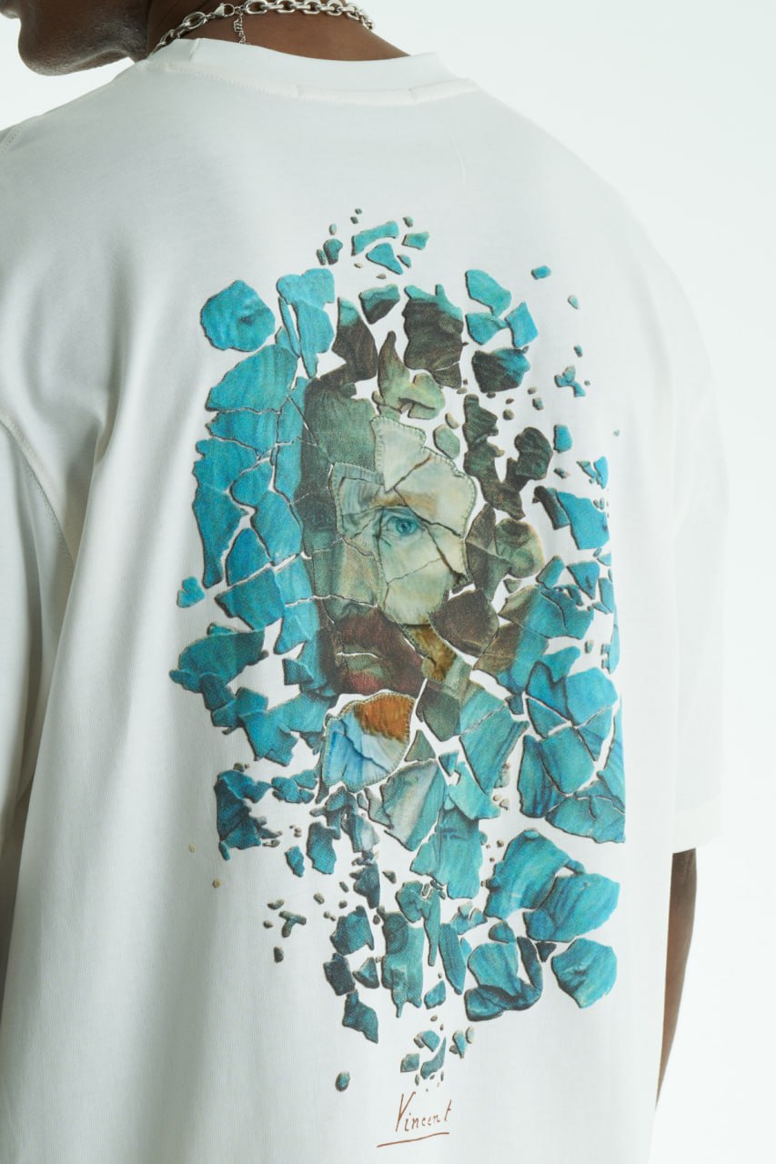 White Vincent oversized cotton graphic T-shirt with shattered portrait back print, shown in navy, black, and white on model