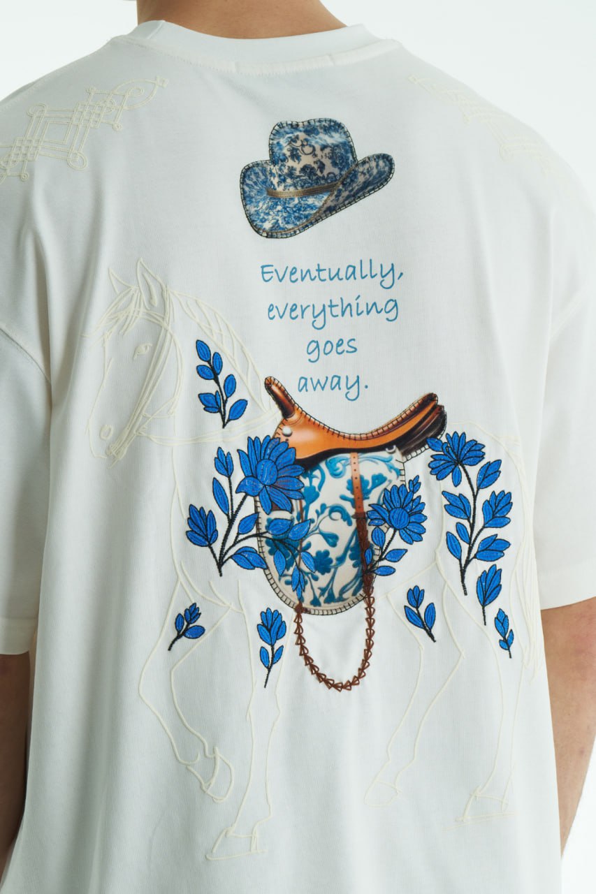 White Oversized graphic T-shirt with chest print and large back horse-and-hat artwork reading “Eventually, everything goes away.”
