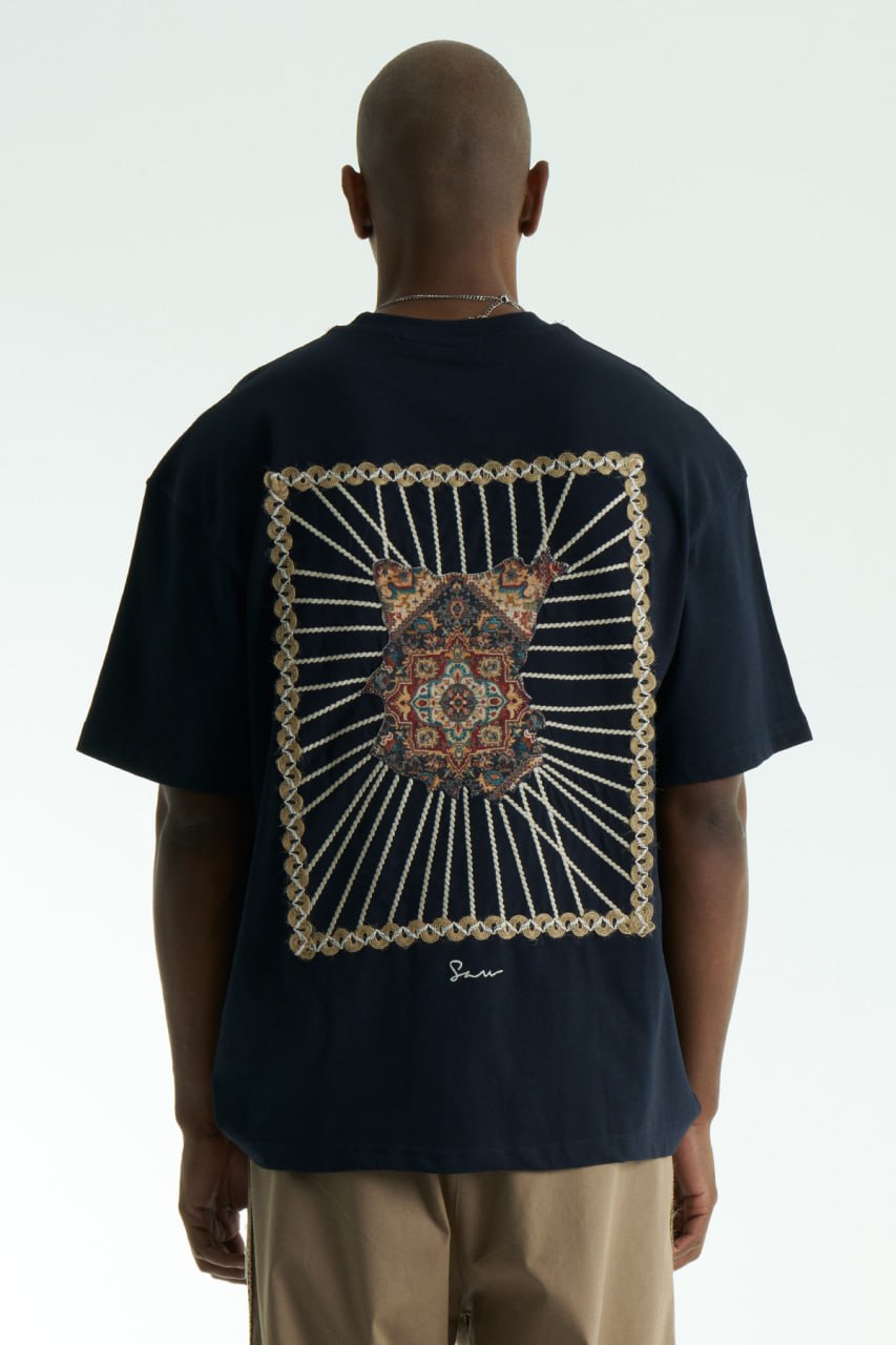 Navy Senu oversized crewneck graphic T-shirt with rope-frame tapestry emblem, shown in black, white, brown and navy with front and back views