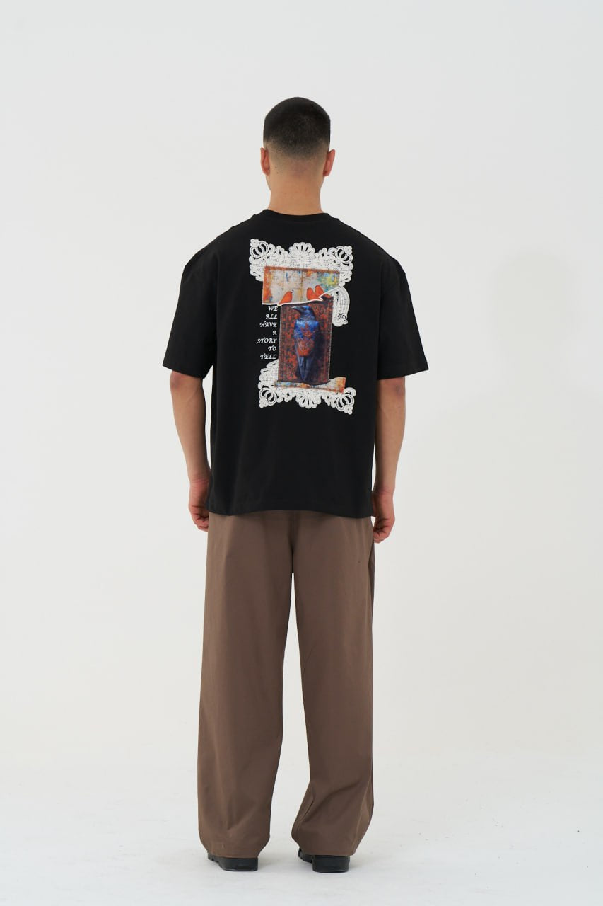 Black Oversized Graphic T-Shirt with “We All Have Stories to Tell” Back Print