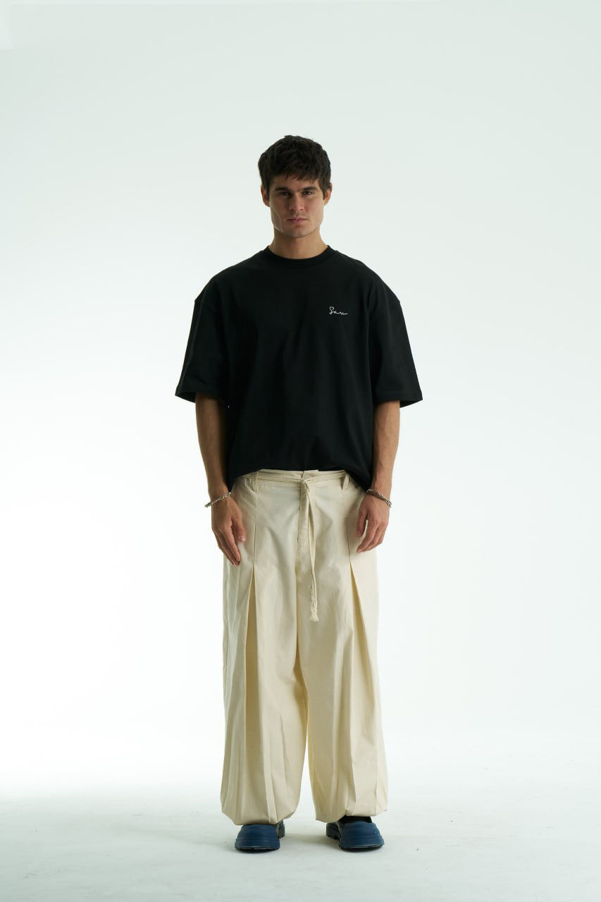 Black Oversized Sons crew-neck T-shirt with chest script logo and ornate fringed back patch, shown in black and white