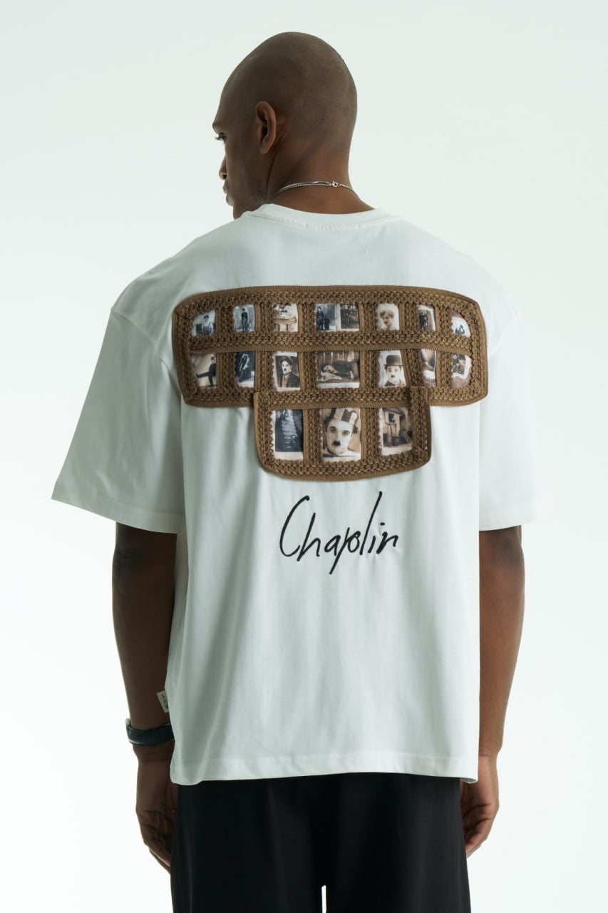 White Chaplin oversized cotton graphic T-shirt with front script logo and collage patch back, shown in black and white