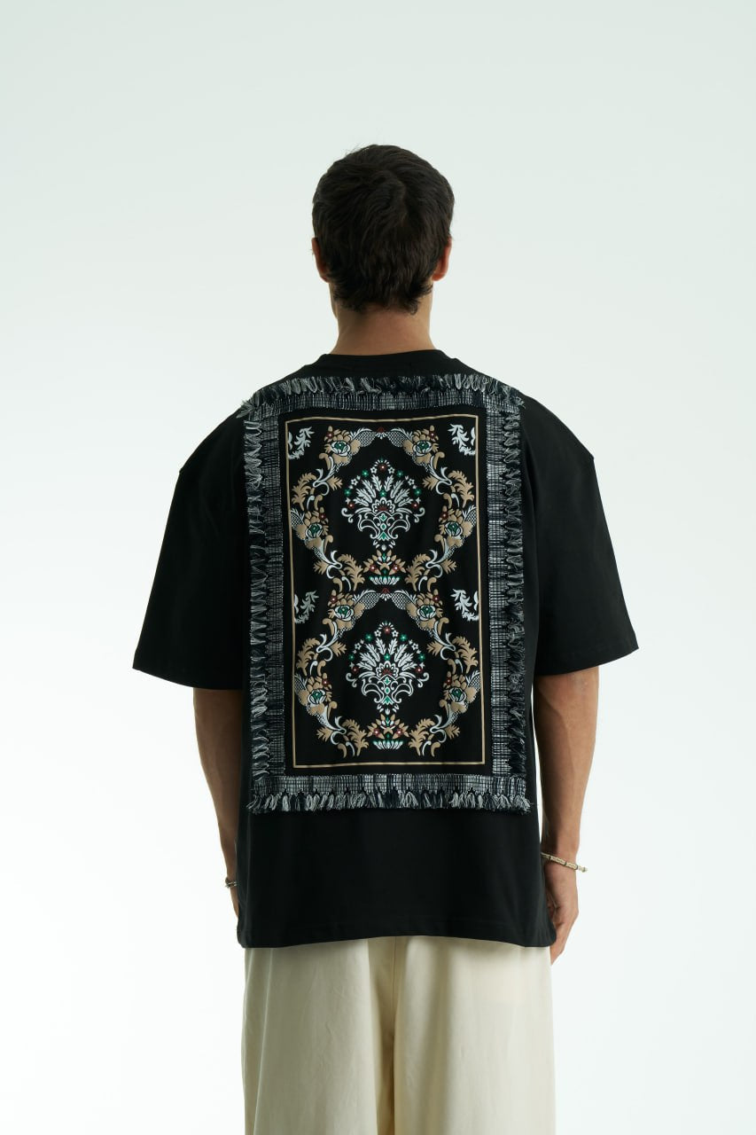 Black Oversized Sons crew-neck T-shirt with chest script logo and ornate fringed back patch, shown in black and white