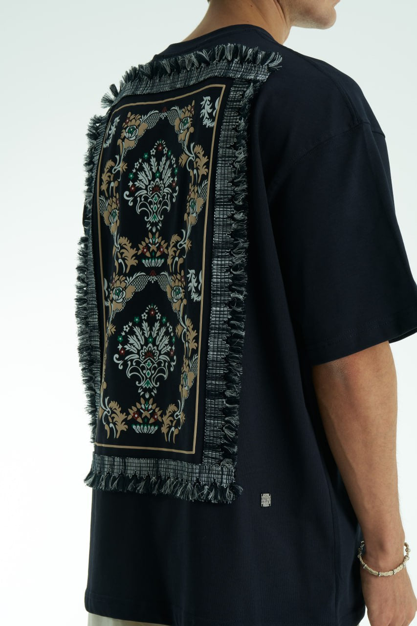 Black Oversized Sons crew-neck T-shirt with chest script logo and ornate fringed back patch, shown in black and white