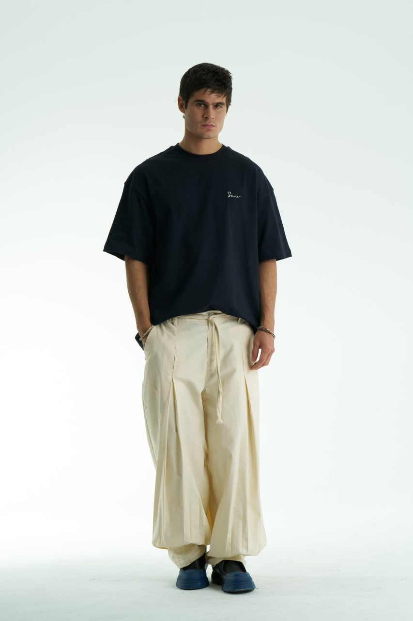 Black Oversized Sons crew-neck T-shirt with chest script logo and ornate fringed back patch, shown in black and white