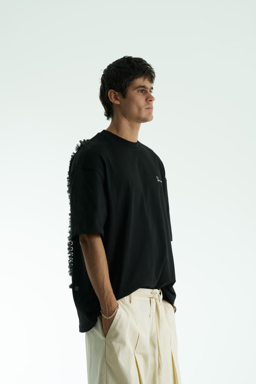 Black Oversized Sons crew-neck T-shirt with chest script logo and ornate fringed back patch, shown in black and white