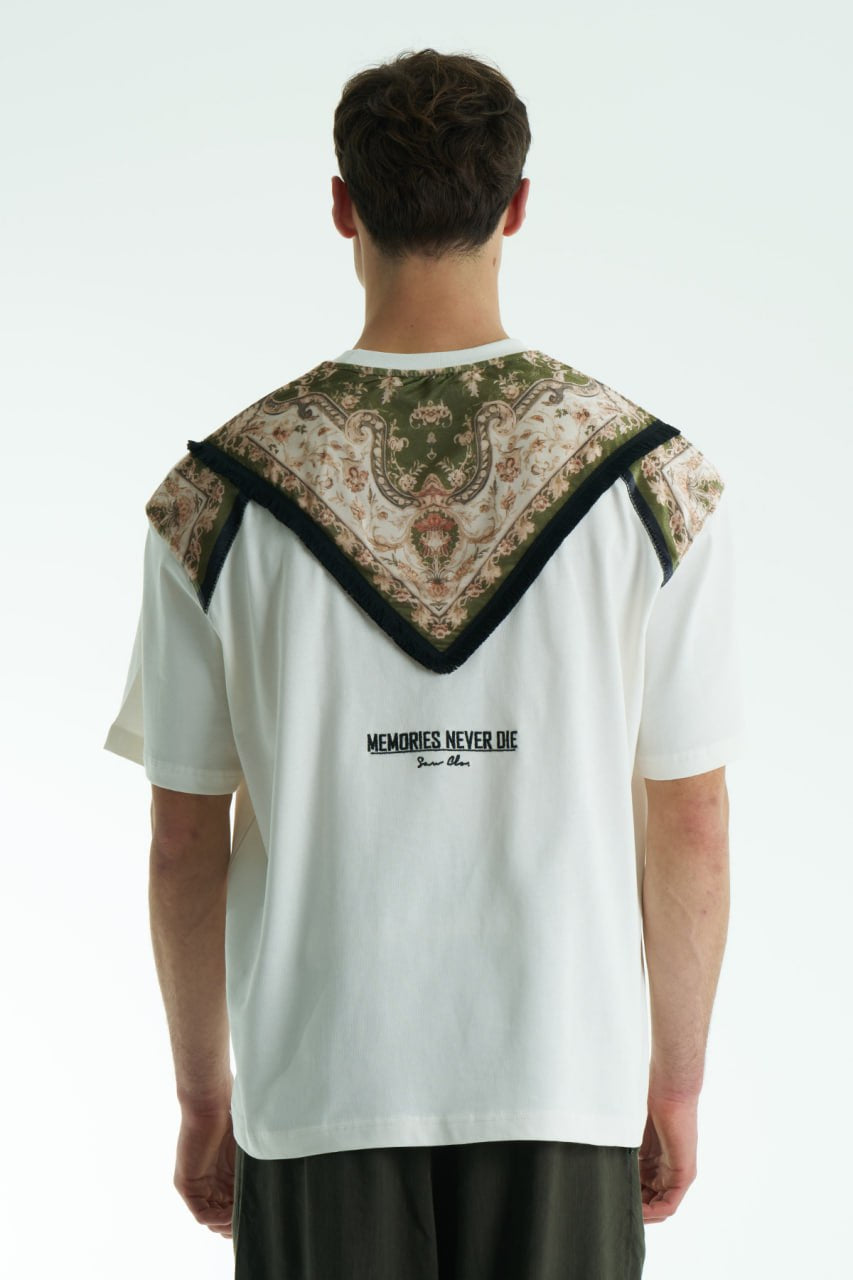 White Oversized Memories Never Die cotton tee with chest pocket appliqué and scarf-style back yoke, shown in white, beige, and black.