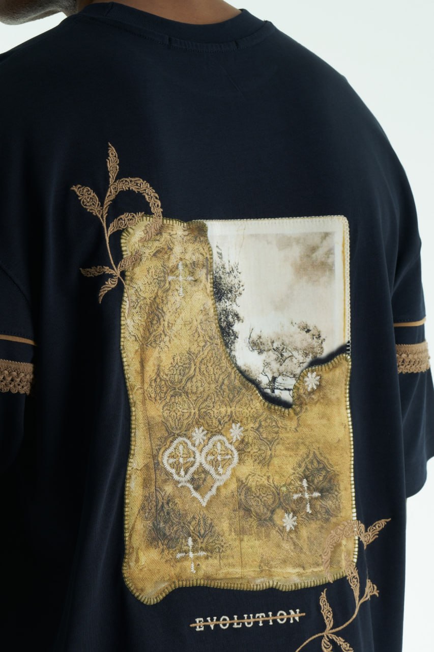 Navy Evolution oversized crewneck graphic T-shirt with sleeve trim and ornate back print in black, white, navy, and cream
