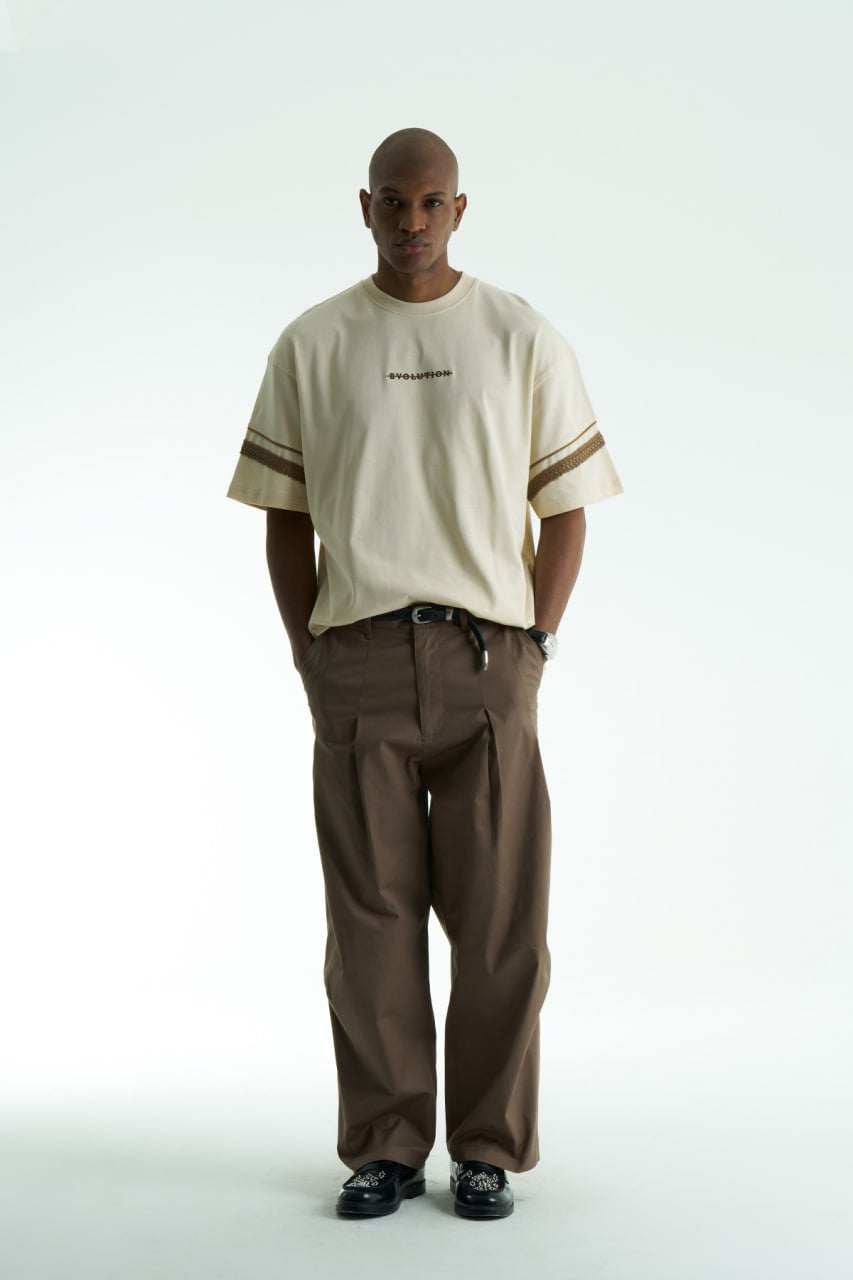 Cream Evolution oversized crewneck graphic T-shirt with sleeve trim and ornate back print in black, white, navy, and cream