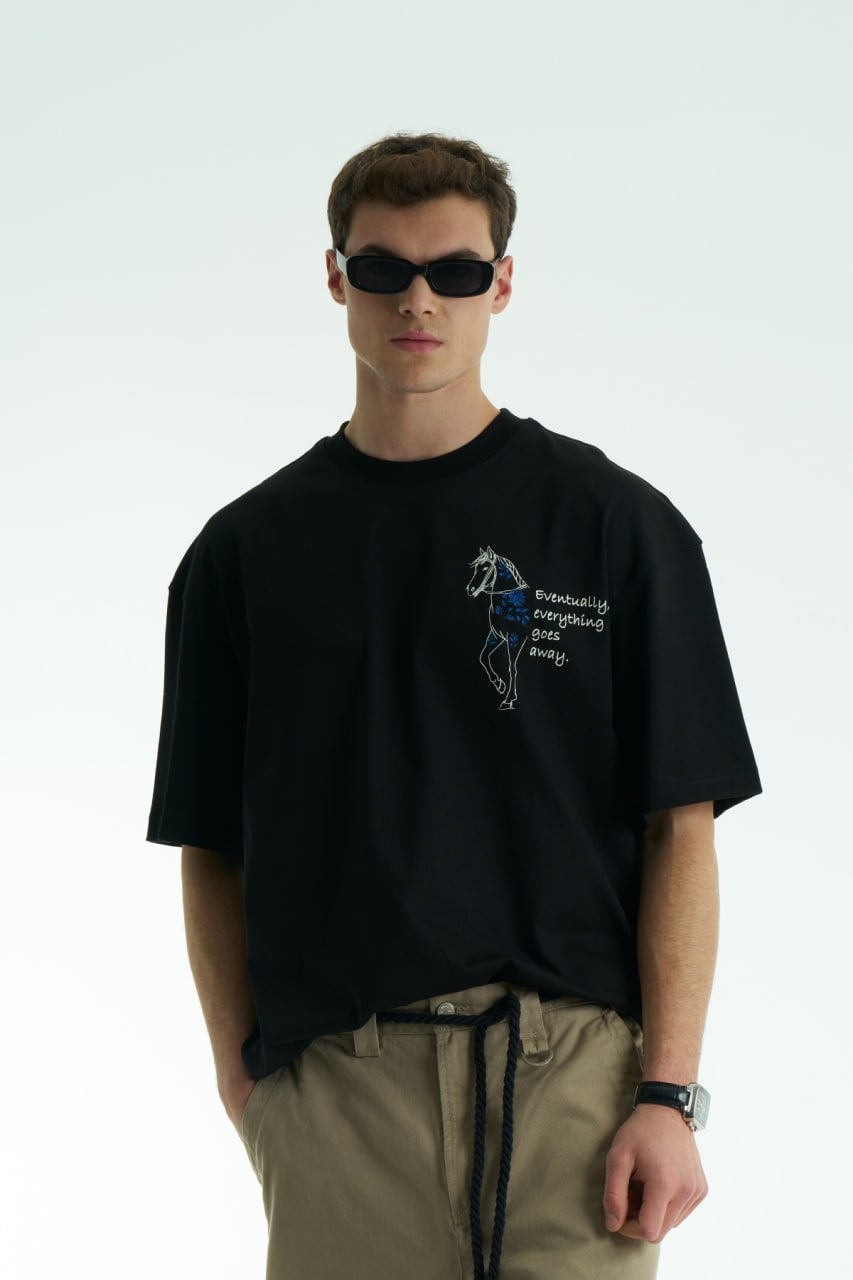 Black Oversized graphic T-shirt with chest print and large back horse-and-hat artwork reading “Eventually, everything goes away.”