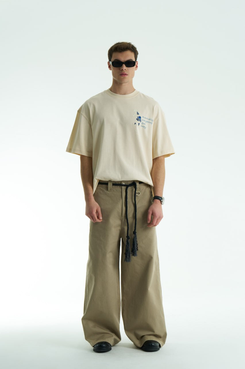 Cream Oversized graphic T-shirt with chest print and large back horse-and-hat artwork reading “Eventually, everything goes away.”