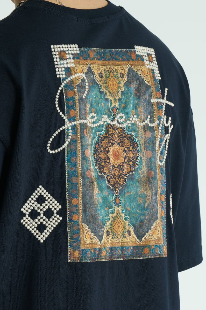 Navy Oversized Sam graphic T-shirt with ornate back print and rhinestone-style detailing, shown in white, black, brown and navy