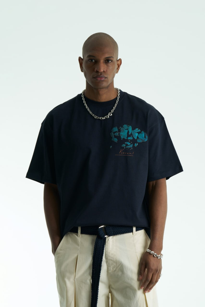 Navy Vincent oversized cotton graphic T-shirt with shattered portrait back print, shown in navy, black, and white on model
