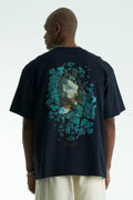 Navy Vincent oversized cotton graphic T-shirt with shattered portrait back print, shown in navy, black, and white on model