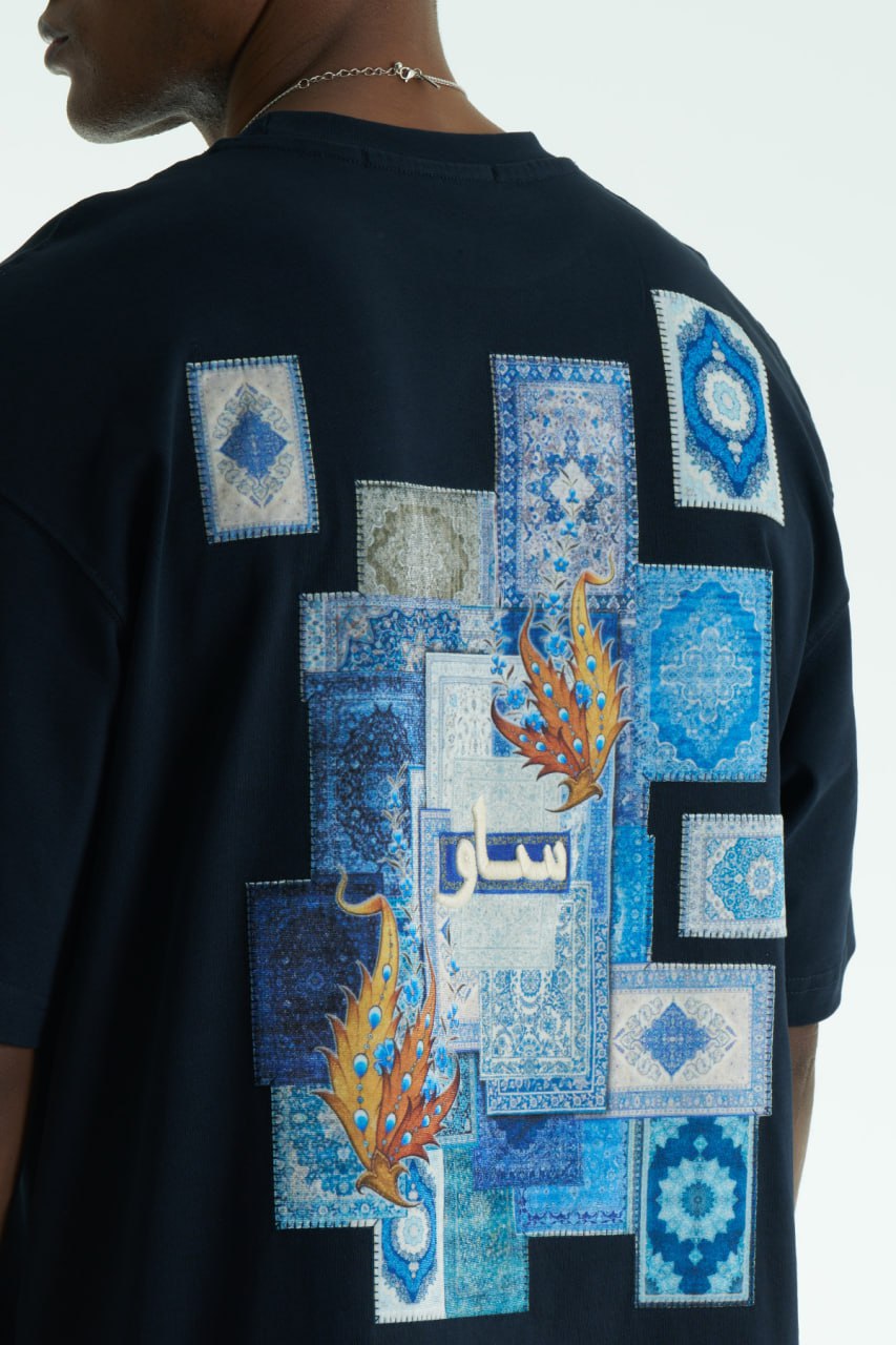 Navy Oversized SAVO graphic cotton T-shirt with small chest print and large blue tile-collage back print, shown in multiple colors