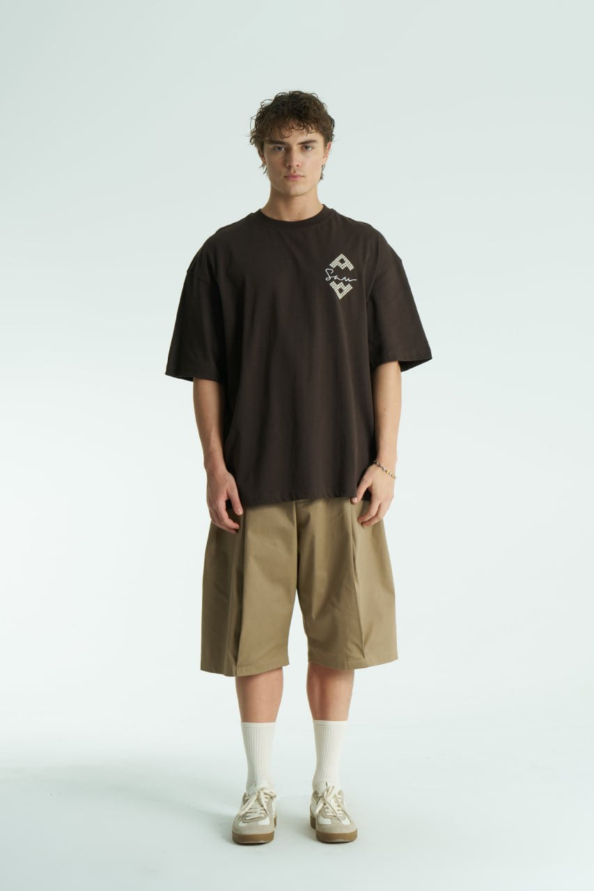 Brown Oversized Sam graphic T-shirt with ornate back print and rhinestone-style detailing, shown in white, black, brown and navy